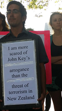 “John Key’s arrogance” placard at today’s rally. Image: David Robie/PMC