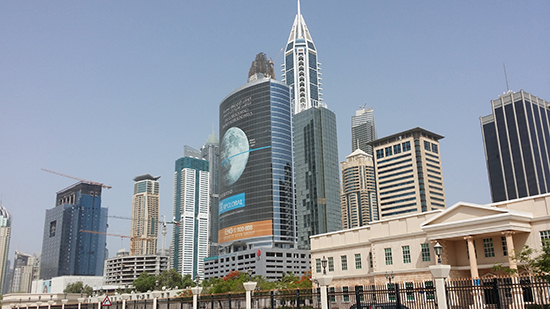  The entrance to the host American University of Dubai (sand-coloured building) is dwarfed by the Media City skyline. Image: PMC