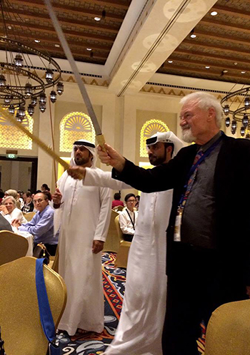 PMC's David Robie gets into the spirit of awards night, brandishing a sword during an Arabian dance.  Khairiah A. Rahman/PMC