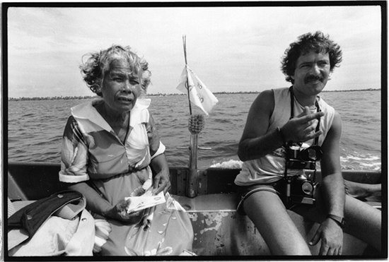 ernando Pereira and Rongelap Islander Bonemej Namwe ride ashore in the “bum bum” runabout at Rongelap in May 1985. Born on Kwajalein, Namwe, was then aged 62 and had lived most of her life on Rongelap. Image: David Robie/Eyes of Fire