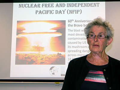 Joan Macdonald of the Women's International League for Peace and Freedom (WILPF) with a message from ICAN against nuclear weapons. Image: Del  Abcede/PMC