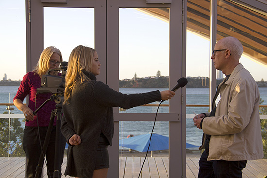 AUT student journalist Senka Bosnyak interviews Little Island Press publisher Tony Murrow at the book launch. Operating the camera is TV journalism lecturer Danni Mulrennan. Image: Del Abcede/PMC