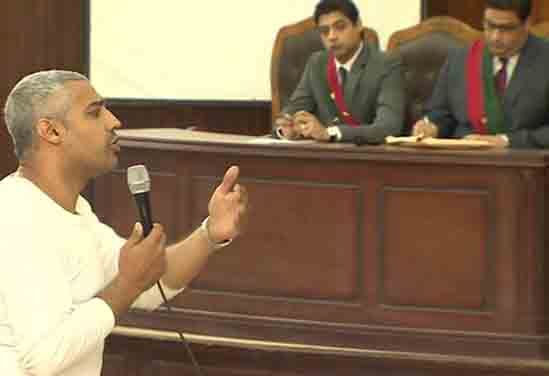 Producer Mohamed Fahmy addressing the Cairo court on Media Freedom Day. Image: Al Jazeera