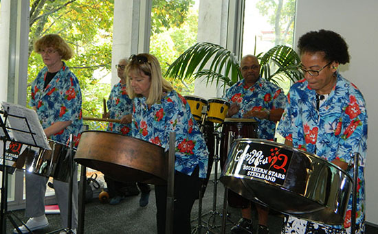 Summit facilitator Dr Camille Nakhid (right), an associate professor in social sciences at Auckland University of Technology and chair of the Migrant Action Trust, performing with her Caribbean Southern Stars steelband colleagues. Image: Del Abcede/PMC