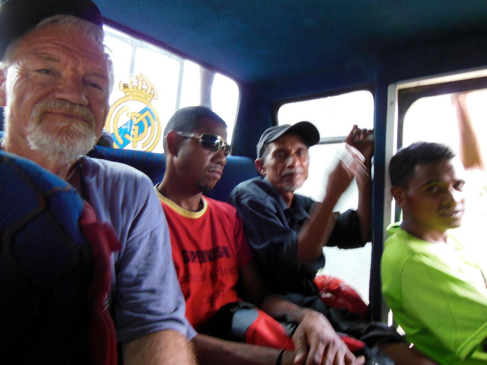 On the bus to Baucau - back seat panorama. Photo: A young woman passenger.