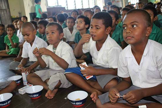 Year One students of Adi Maopa Primary School enjoy their cereal meal. Image: Sophie Ralulu/IB