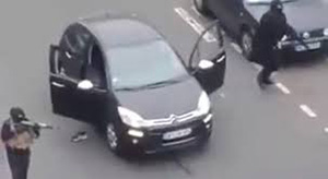 Two of the masked gunman who attacked Charlie Hebdo magazine in Paris. Image: Al Jazeera