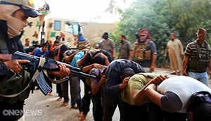 ISIL jihadists executing Iraqi military prisoners. Image: ISIL twitter/TVNZ