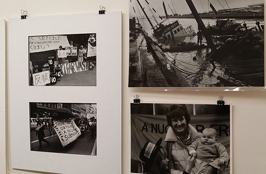 The Rainbow Warrior bombing and other photographs by John Miller at the 30 years of New Zealand’s nuclear-free law exhibition at the Depot Artspace in Devonport this week. Image: David Robie/PMC