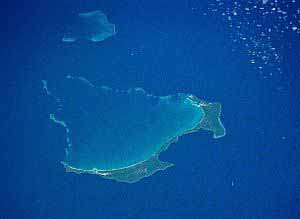 Ouvéa in New Caledonia’s Loyalty Islands … where the Wadrilla cave siege happened in April-May 1988. Image: NASA