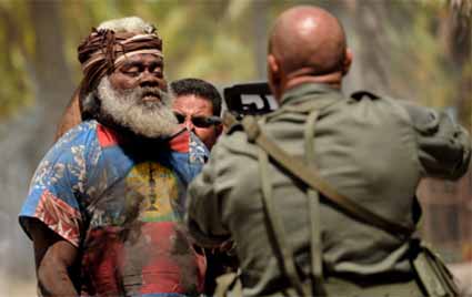 A French military in terrogator holds a gun at the head of a Kanak elder during the search for the hostage cave. Image: Rebellion