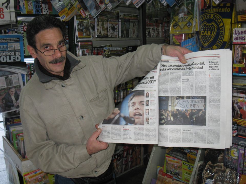 A Buenos Aires newspaper vendor with a Clarin newspaper report and picture of the previous night's cacerolazo in Recoleta. Photo: David Robie