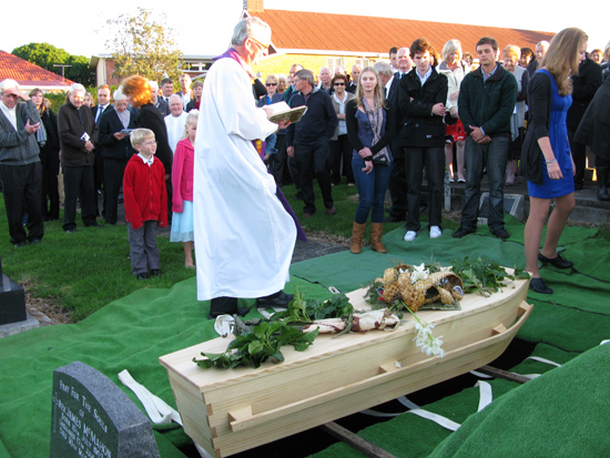 Bishop Patrick Dunn giving prayers at the burial of much loved activist priest Father Terry Dibble at the priestly enclave in St Patrick's cemetery, Panmure, today. Photo: Sally James/PMC