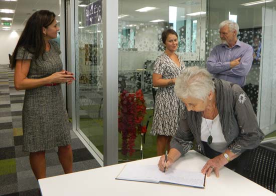 Lady Beverley Reeves signs the PMC visitor's book while at the centre with her whanau, daughters Bridget (left) and Jane today. Image: Del Abcede/PMC