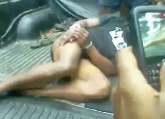 Torture of the captured Fiji fugitive being filmed on mobile phones.  Photo: Pacific Media Watch/Freeze frame from video