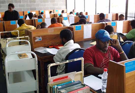 Students researching in UPNG's Sir Michael Somare Library. Image: PMC