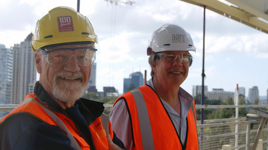 PMC director David Robie and Stanley Frielick taking a peek at progress on the new building. Photo: James Charlton/AUT